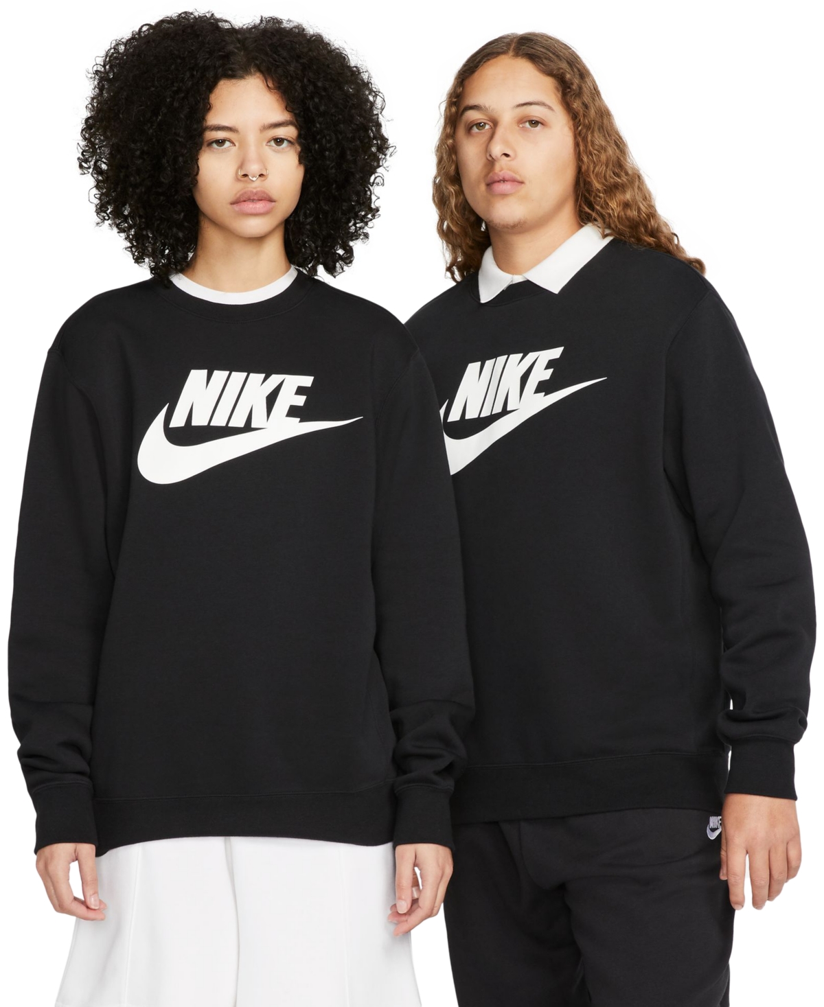 Two individuals are wearing black Nike crewneck sweatshirts with the brand's white swoosh logo prominently displayed on the front.