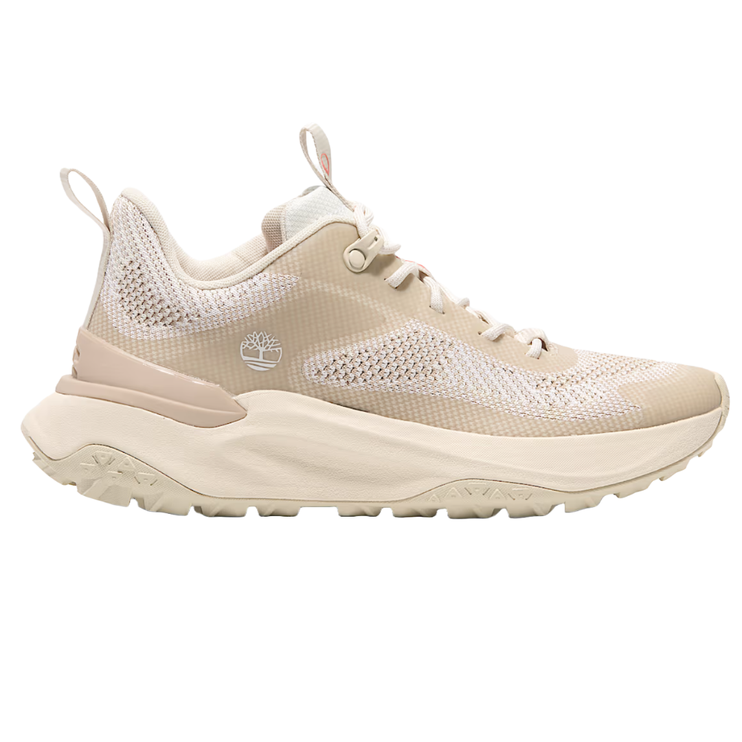 Beige athletic sneaker with a knit upper, thick cushioned sole, and brand logo on the side.