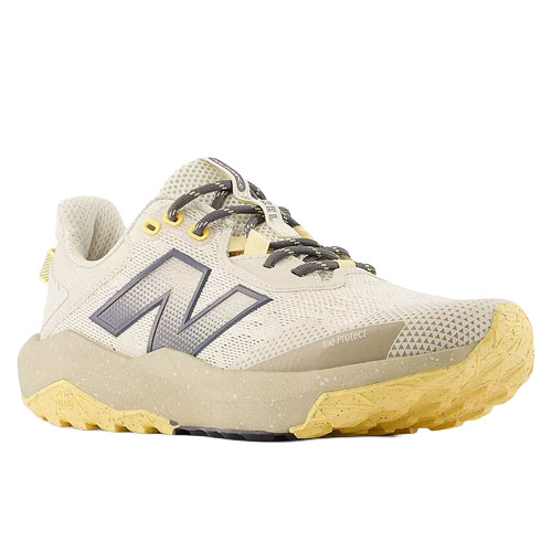 Trail running shoe with beige mesh upper, gray and yellow accents, rugged sole, and New Balance logo.