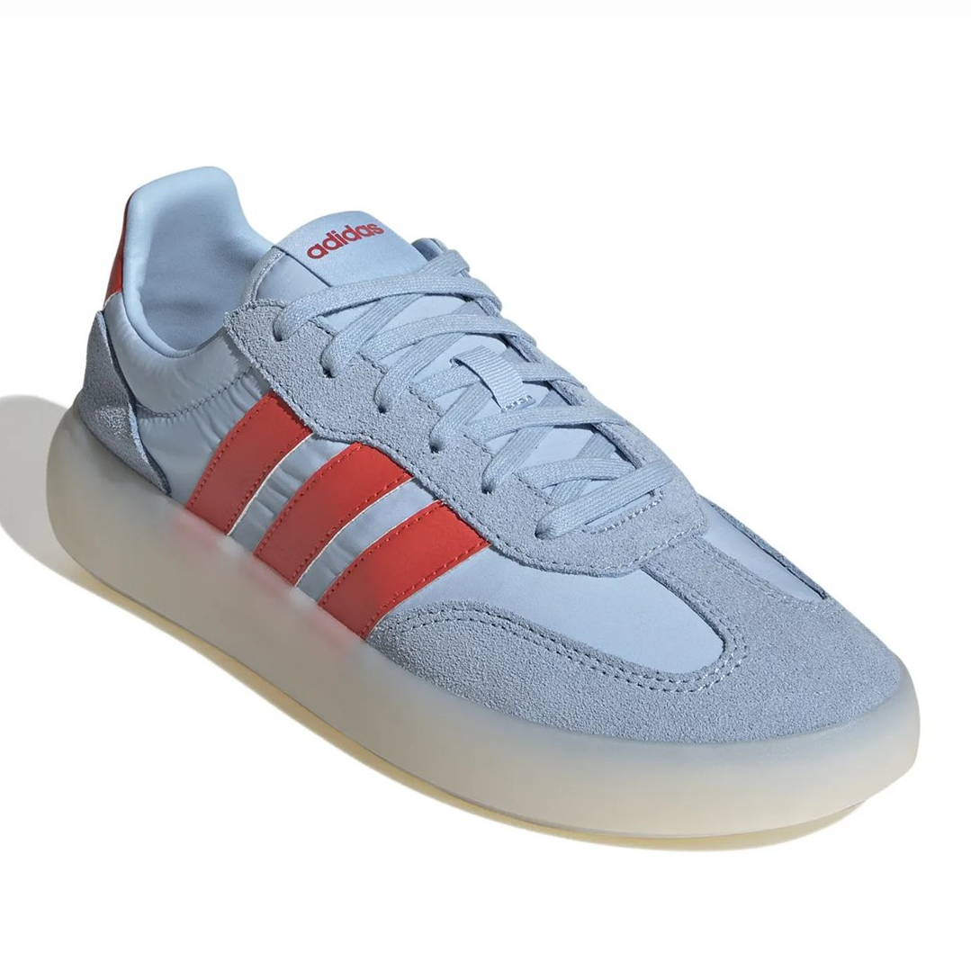 Adidas Barreda Decode Sneakers feature a light blue upper with suede overlays, red three-stripe branding, and a translucent sole, offering a retro-inspired design.