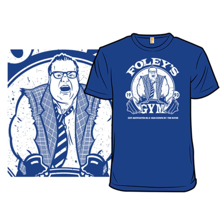 Blue T-shirt with a graphic of a man at a gym with text \“Foley's Gym\“ and \“Get Motivated in a Van Down by the River\“. The design also features the years \“19\“ and \“93\“.