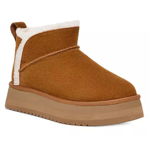 Brown shearling-lined ankle boot with platform sole and pull tab at the back.