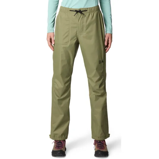 A person is wearing olive green outdoor pants with an elastic waistband and drawstring. They have hiking boots on, featuring pink laces.