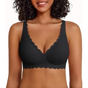 A woman wears a black bralette with scalloped edges and wide straps, suitable for comfortable everyday wear.