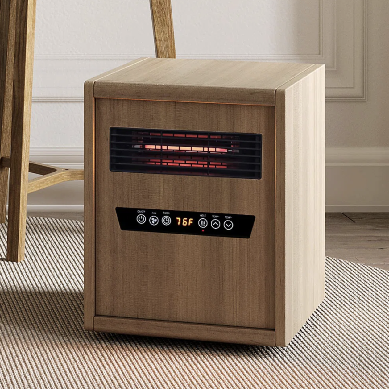 A wooden-cased infrared space heater with digital controls and a temperature display set at 76°F, placed on a carpeted floor.
