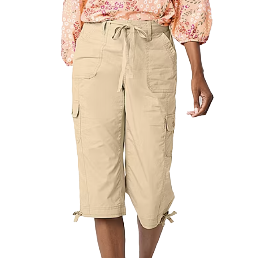 Beige cargo capri pants featuring multiple pockets, a drawstring waist, and leg ties. The pants are paired with a floral patterned blouse.