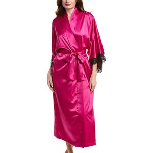 A magenta satin robe with black lace trim on the sleeves, featuring a tie belt around the waist.