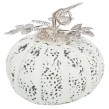 A decorative white pumpkin adorned with black speckles and a metallic vine and leaf design on top.