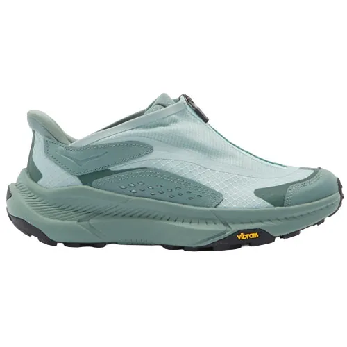 A light teal athletic shoe with a sleek, slip-on design and a Vibram sole for enhanced traction and performance.