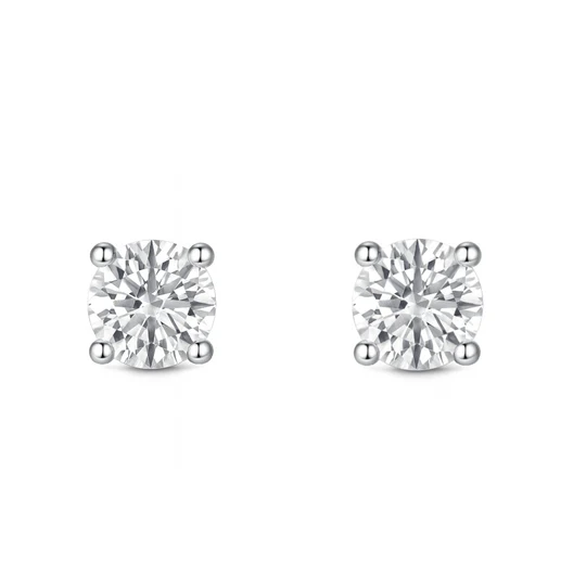 A pair of round diamond stud earrings in a four-prong setting.