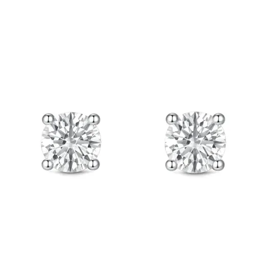 A pair of round diamond stud earrings in a four-prong setting.