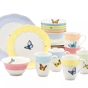 24-piece Lenox dinnerware set features plates, bowls, and mugs adorned with colorful butterfly and floral designs, presented in pastel hues of yellow, blue, pink, and green.