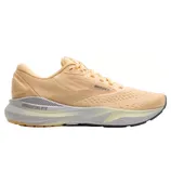 Peach-colored running shoe by Brooks, featuring a cushioned sole with \“Adrenaline\“ branding for support and comfort.