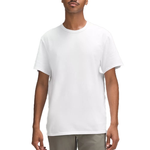 White cotton jersey t-shirt, short-sleeved, crew neck, with a relaxed fit. Paired with olive green pants.