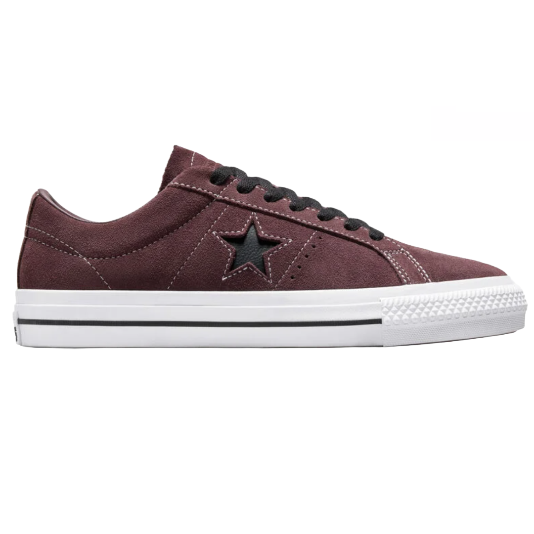Converse One Star Pro Suede Shoes feature a low-top design with a rich maroon suede upper, black laces, and a signature star cutout on the side. They have a white midsole with black stripe detailing and a textured rubber toe cap.