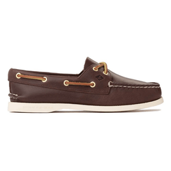 Brown leather boat shoe with white sole, featuring tan laces threaded through gold eyelets, and a moccasin-style front seam.