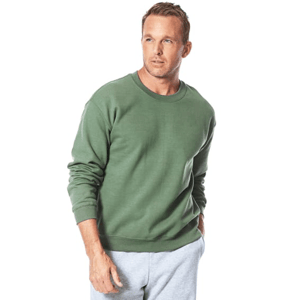 A man is wearing a forest green crewneck sweatshirt and light gray sweatpants, posing casually.