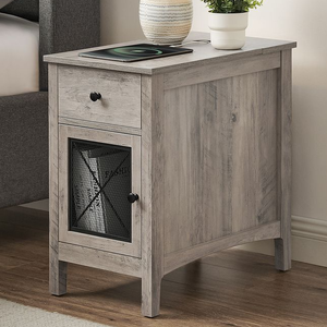 Light gray wooden nightstand with a drawer and mesh-front cabinet, featuring black knobs. Items on top include a plant in a white pot and a tablet.