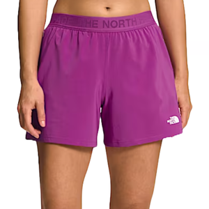 Purple women's athletic shorts by The North Face featuring an elastic waistband with the brand's name and a small white logo on the left leg.