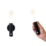 A wall-mounted LED light with a cylindrical design, which is detachable for handheld use.