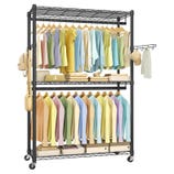A metal clothing rack on wheels featuring two hanging bars with neatly arranged colorful clothes, a middle shelf with accessories, and a bottom shelf with storage boxes. It also includes side hooks for additional accessories.