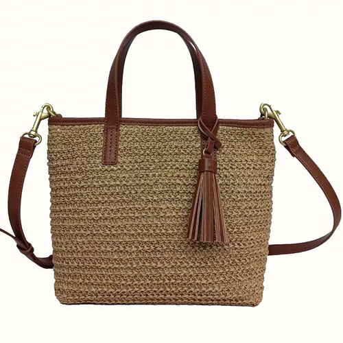 Rectangular woven tote with brown leather trim, detachable shoulder strap, and tassel embellishment.