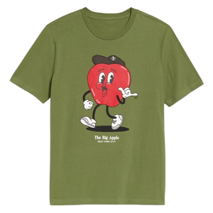 A green t-shirt featuring a cartoon red apple with arms and legs, wearing a hat and sneakers, with the text \“The Big Apple New York City\“ underneath.