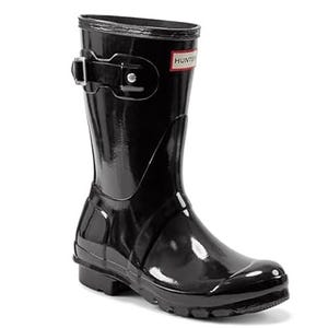Black Hunter Gloss Short Boots with a sleek, shiny finish, featuring an adjustable strap and buckle on the side for a secure fit. The boots have a rounded toe and textured soles for improved traction.