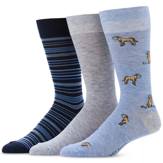 A set of three men's socks featuring patterns: navy with blue stripes, solid gray, and light blue with dog illustrations.