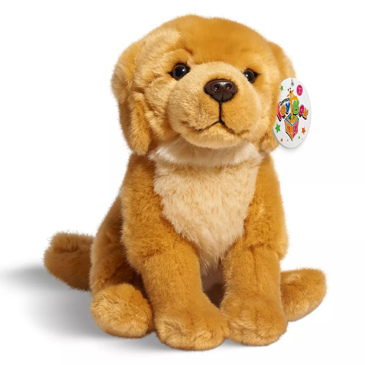 A plush toy resembling a golden retriever puppy, featuring soft brown and cream-colored fur with a tag labeled \“Toy Box.\“