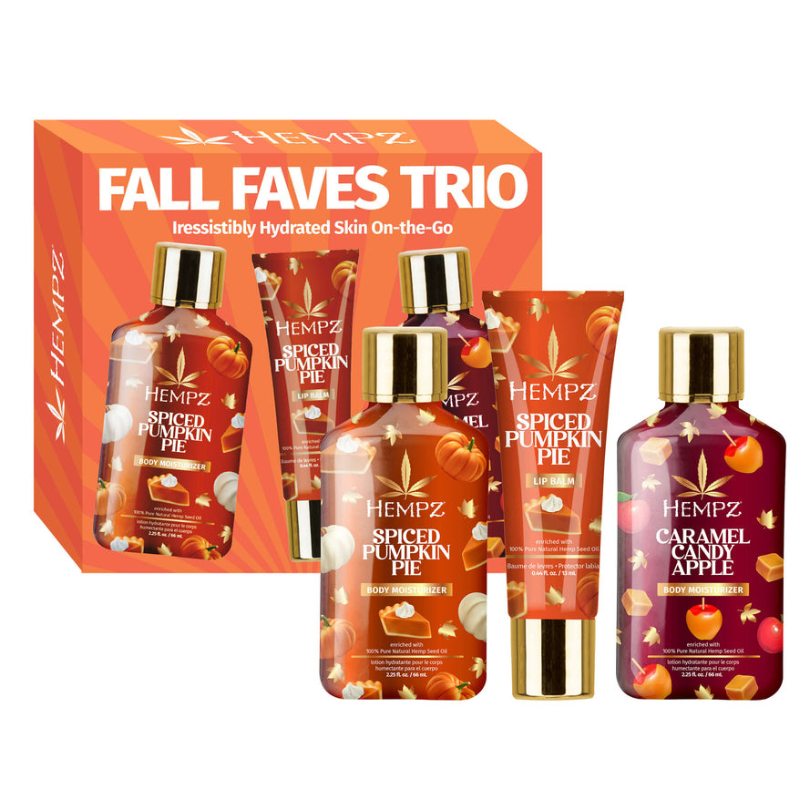 Hempz Fall Faves Trio includes Spiced Pumpkin Pie Body Moisturizer, Spiced Pumpkin Pie Lip Balm, and Caramel Candy Apple Body Moisturizer, all featuring seasonal scents.