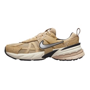 Nike Zoom Vomero 5 sneaker in a beige colorway with mesh and suede materials, featuring a cushioned midsole and a prominent black Swoosh logo.