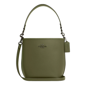 Olive green Coach City Bucket Bag with a textured leather finish, featuring a top handle, detachable shoulder strap, metal logo on the front, and a matching leather tag.