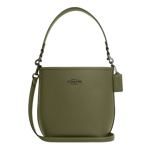 Olive green Coach City Bucket Bag with a textured leather finish, featuring a top handle, detachable shoulder strap, metal logo on the front, and a matching leather tag.