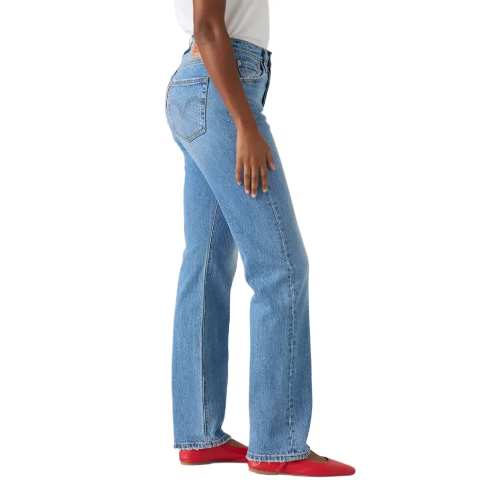 Model wearing light blue straight-leg jeans with a high waist, paired with red flats.