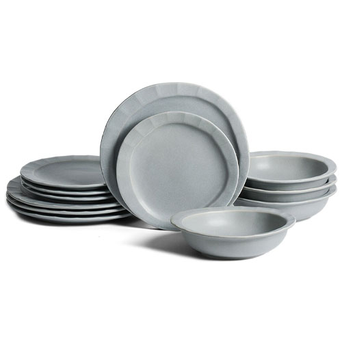 A set of gray melamine dinnerware includes plates and bowls, featuring a minimalist design.