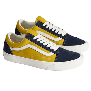 Yellow and navy low-top sneakers with a classic white side stripe, white laces, and a white rubber sole.