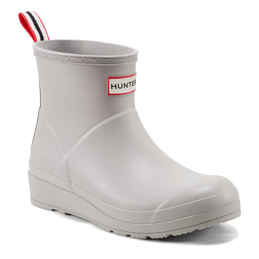 A light gray Hunter rain boot with a red-striped pull tab and the Hunter logo on the front.