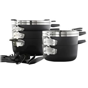 Stacked nonstick cookware set with utensils featuring pots and pans, stainless steel accents, and handles labeled \“Select by Calphalon.\“