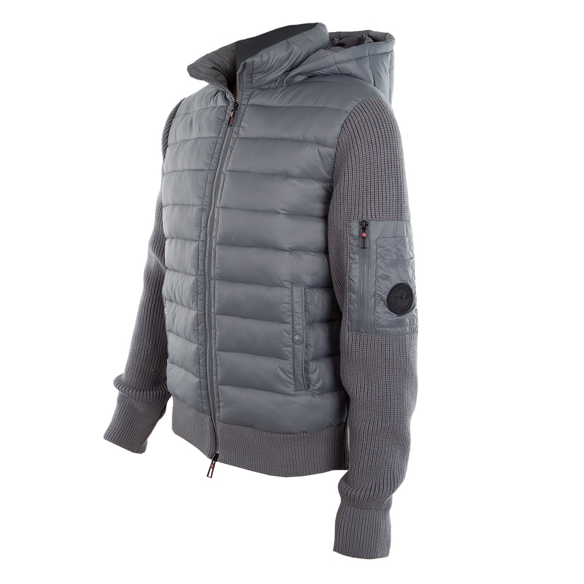 A gray puffer jacket with a hood, featuring quilted body panels and knit sleeves. The design includes a ribbed cuff and a utility pocket on the left arm.