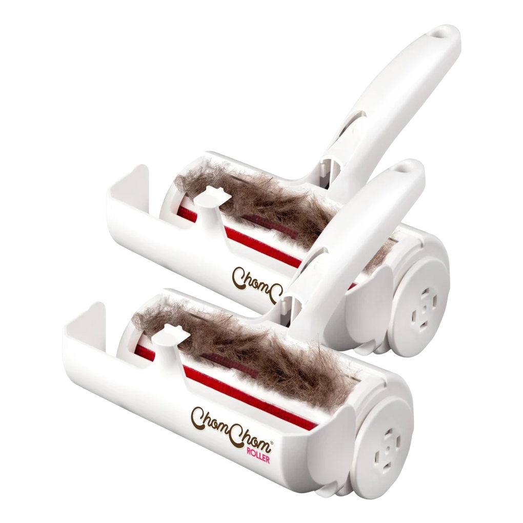 Two white pet hair rollers designed for removing pet hair, featuring a handle and a red roller surface. Each roller has a compartment to collect the hair, and the design includes side wheels for easy maneuverability.