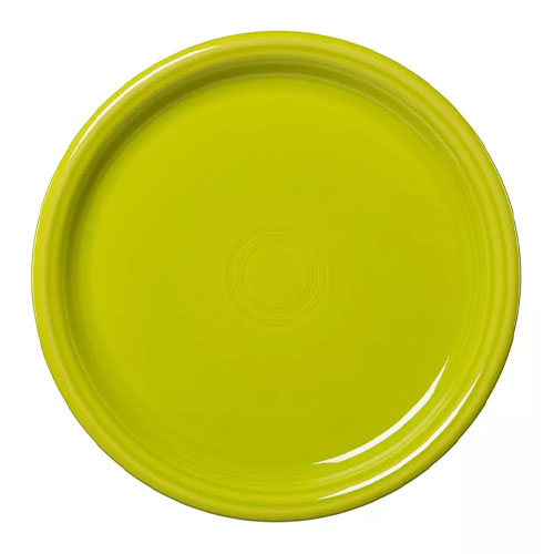 A vibrant, round, yellow-green ceramic plate with a glossy finish and subtle concentric design at the center, part of the Fiesta Bistro Dinnerware collection.