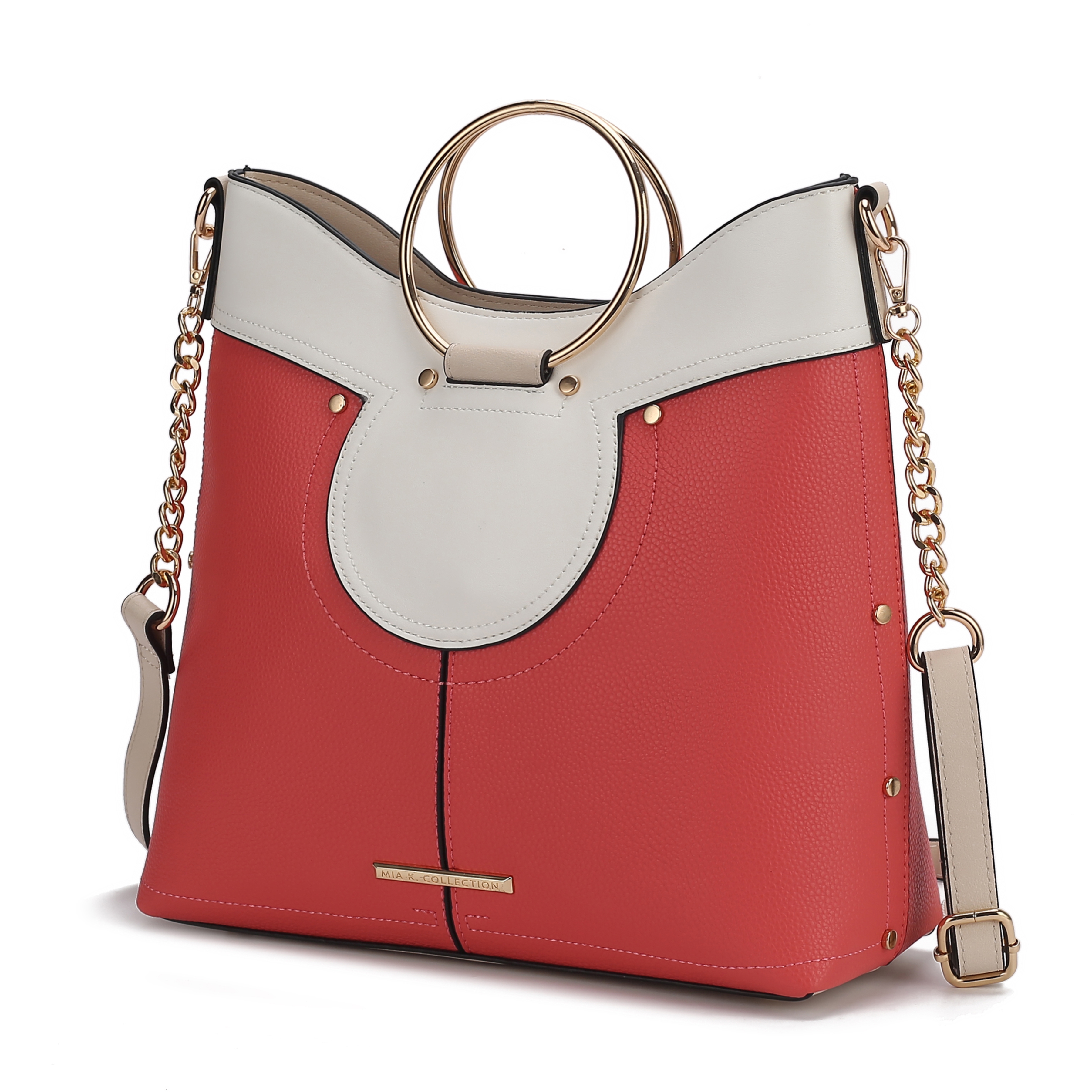 A stylish handbag featuring a red and white color block design with gold ring handles and chain strap accents.