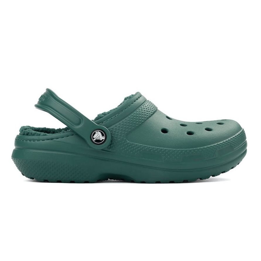 A green, fleece-lined clog with ventilation holes and a rotating heel strap, featuring a circular logo on the side.