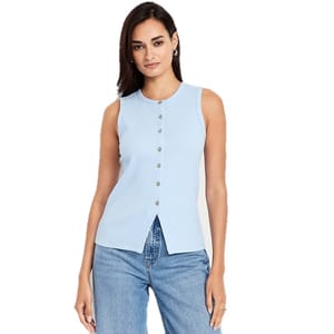 Sleeveless light blue button-up top with a ribbed texture and a front slit. Paired with casual blue jeans.