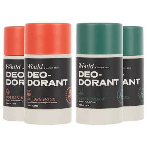 Four deodorant sticks labeled \“Would DEODORANT,\“ featuring two scents: \“Golden Hour\“ with Madagascar vanilla, and \“Fresh Tracks\“ with balsam and pink pepper. Each stick is 2.6 fl oz (76.8g).
