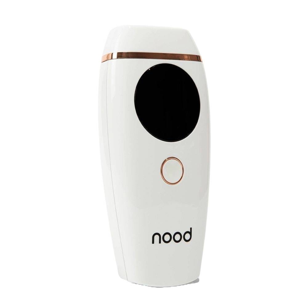 A white handheld IPL hair removal device with a circular button and black sensor area, featuring a rose gold trim. The brand \“nood\“ is displayed at the bottom.