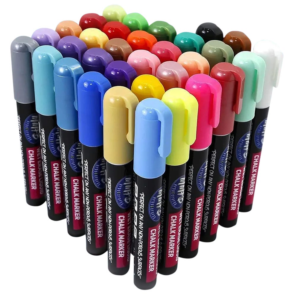 A set of colorful chalk markers with black barrels and varying colored caps, arranged in neat rows.