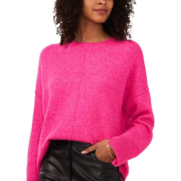 A vibrant pink, long-sleeve soft sweater with a round neckline and ribbed cuffs, paired with black leather pants.