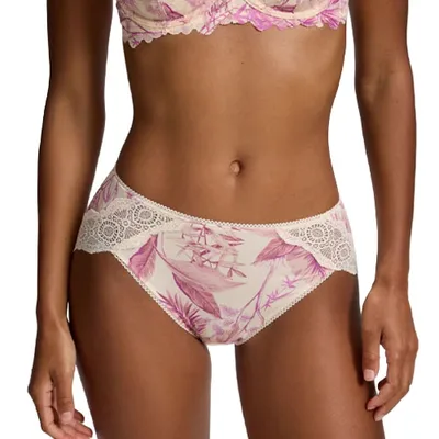 A model wearing a floral-patterned bra and matching panties featuring lace trim and decorative hem stitching. The design incorporates pink and white colors with leaf motifs.